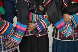 Akha women holding hands.