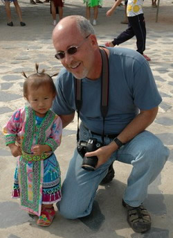 Guest with Hmong Child in traditional dress.
