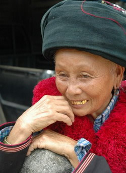 Alt Text: A Yao woman in tradional costume.