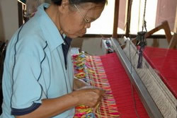 Tai Lue woman weaving